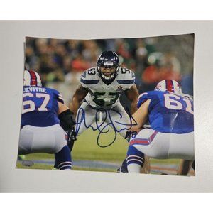 Autographed photograph by Malcolm Smith of the Seahawks 2013